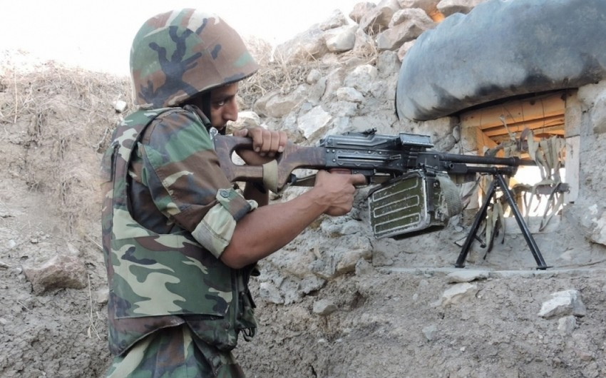 Armenian forces shelling Azerbaijani army positions